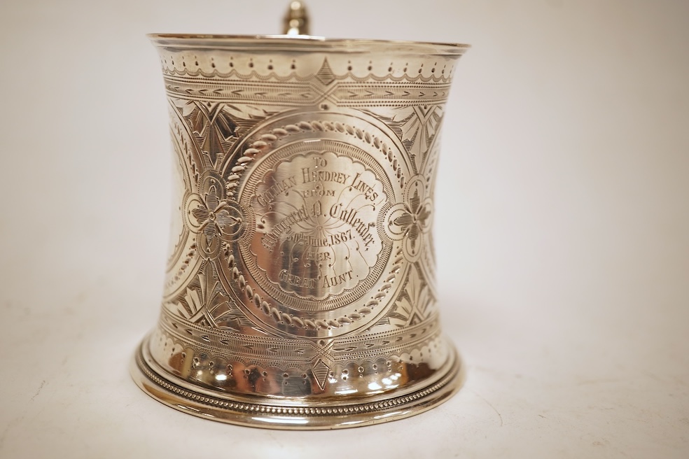 A Victorian bright cut engraved silver christening mug, of waisted form, with engraved inscription and beaded handle, Samuel Roberts & Charles Belk, Sheffield, 1867, 82mm, 5.2oz.